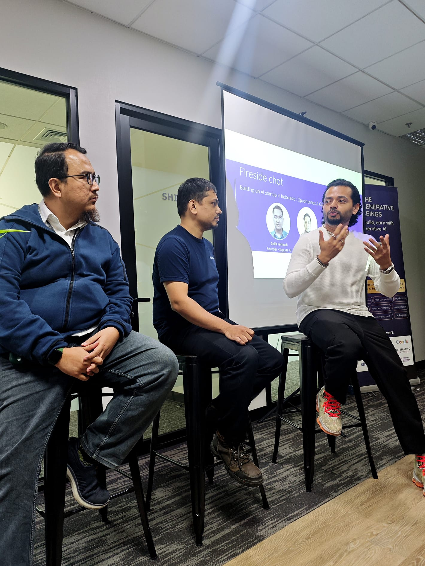 Speakers in a fireside panel discussion